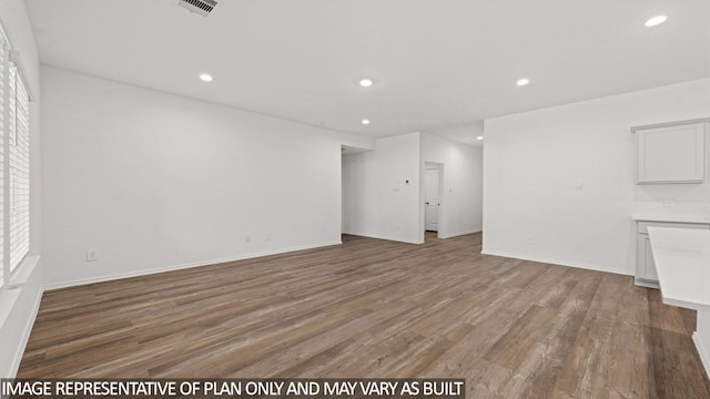 unfurnished living room featuring hardwood / wood-style floors