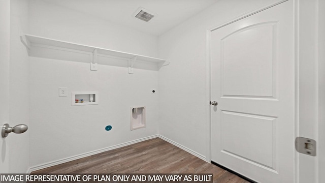 laundry room featuring dark wood-type flooring, hookup for a washing machine, and electric dryer hookup