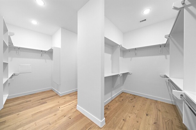 spacious closet with visible vents and light wood-style flooring