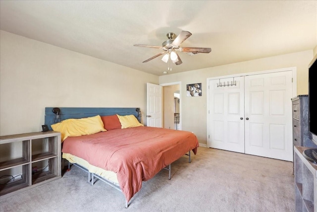 bedroom featuring light carpet, a closet, and ceiling fan