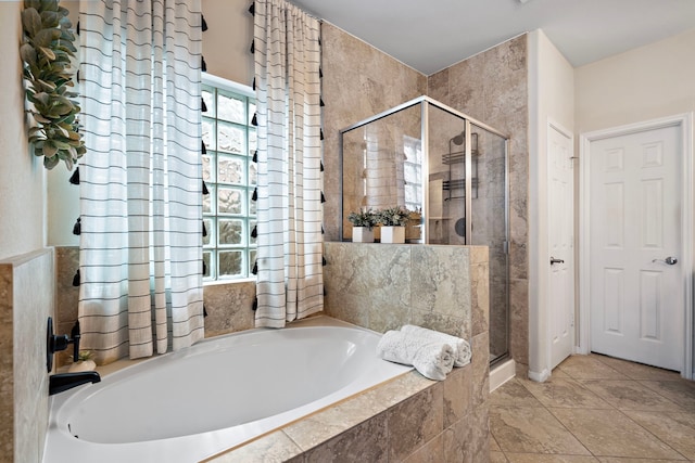 bathroom with shower with separate bathtub