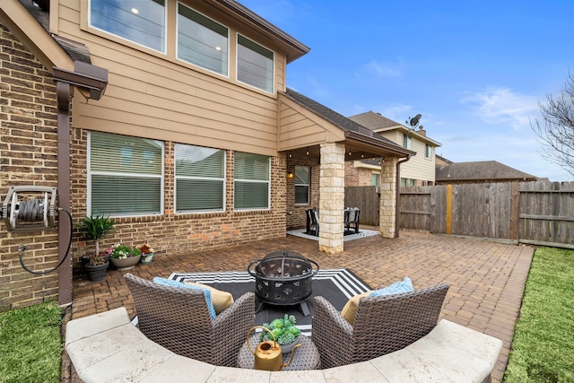 view of patio with a fire pit