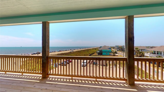 wooden deck featuring a water view