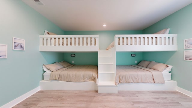 bedroom with light hardwood / wood-style flooring