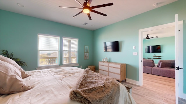 bedroom featuring ceiling fan and light wood-type flooring