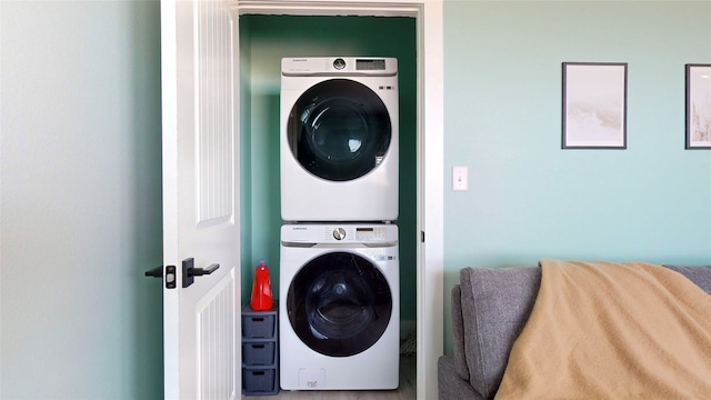 laundry room featuring stacked washer and clothes dryer