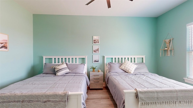 bedroom featuring ceiling fan and light wood-type flooring