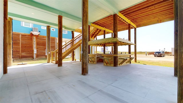 view of patio / terrace with outdoor dry bar and stairway