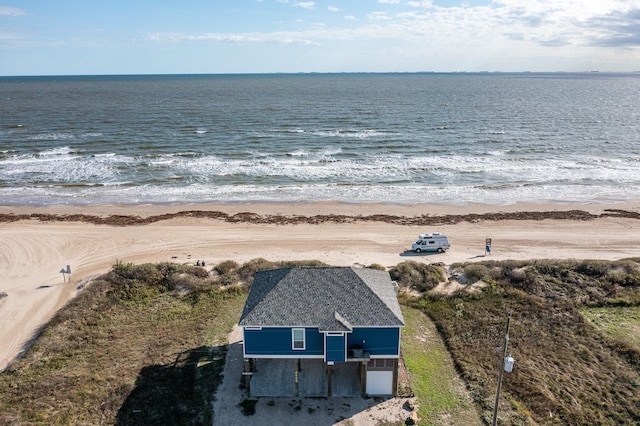 bird's eye view featuring a water view and a view of the beach