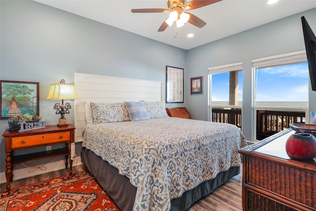 bedroom with ceiling fan, access to exterior, and light hardwood / wood-style floors