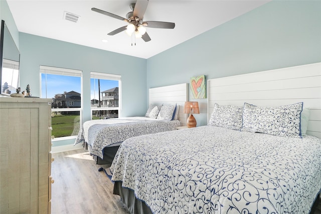 bedroom featuring light hardwood / wood-style floors and ceiling fan