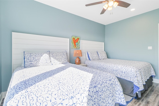 bedroom featuring wood-type flooring and ceiling fan