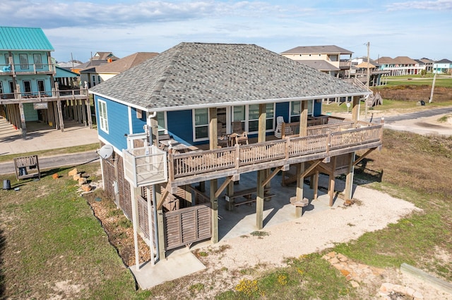 rear view of property with a deck