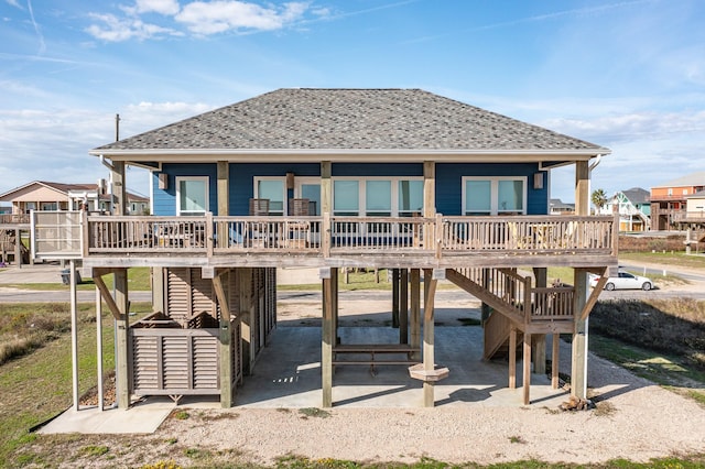 rear view of house with a patio area and a porch