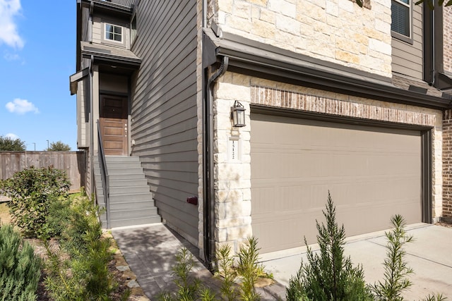 view of side of home with a garage