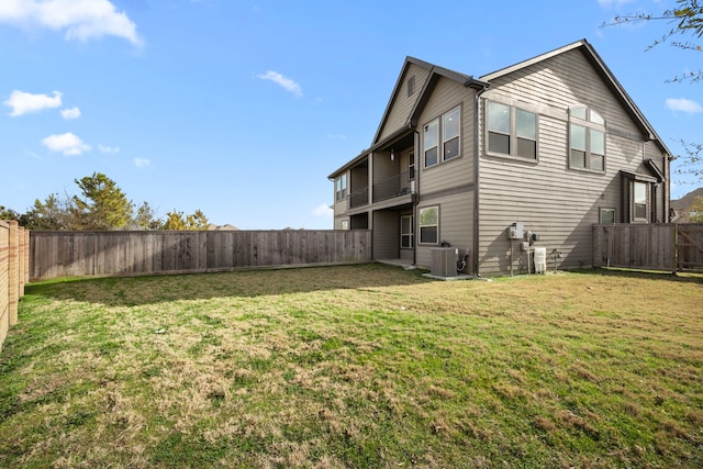 exterior space featuring a yard and central air condition unit