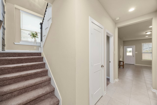 stairs featuring tile patterned floors