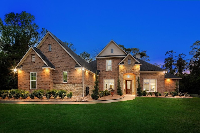 view of front of house with a yard