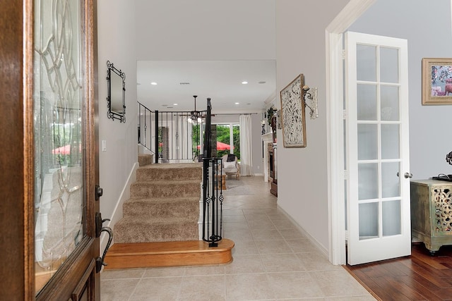 hall with light tile patterned floors