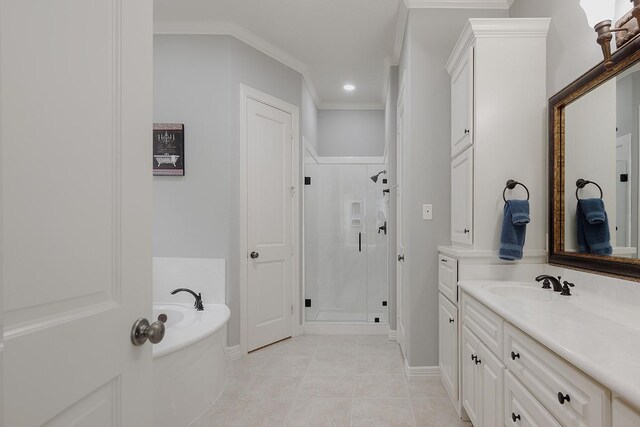 bathroom with crown molding, separate shower and tub, vanity, and tile patterned floors