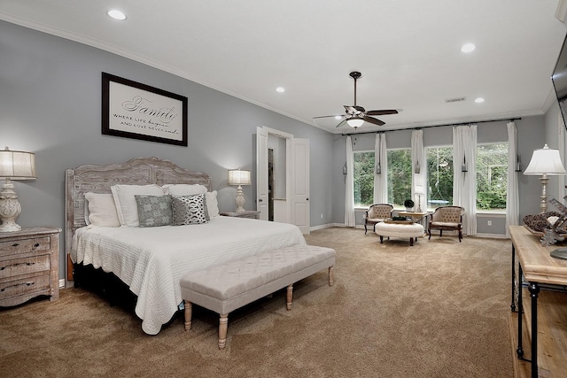 bedroom featuring ornamental molding, carpet flooring, and ceiling fan