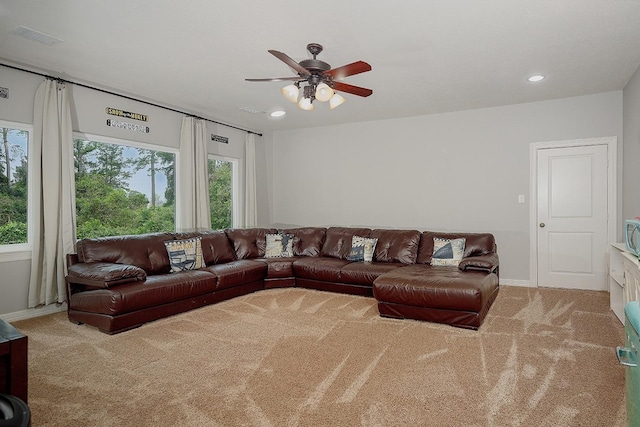 living room featuring ceiling fan and light colored carpet