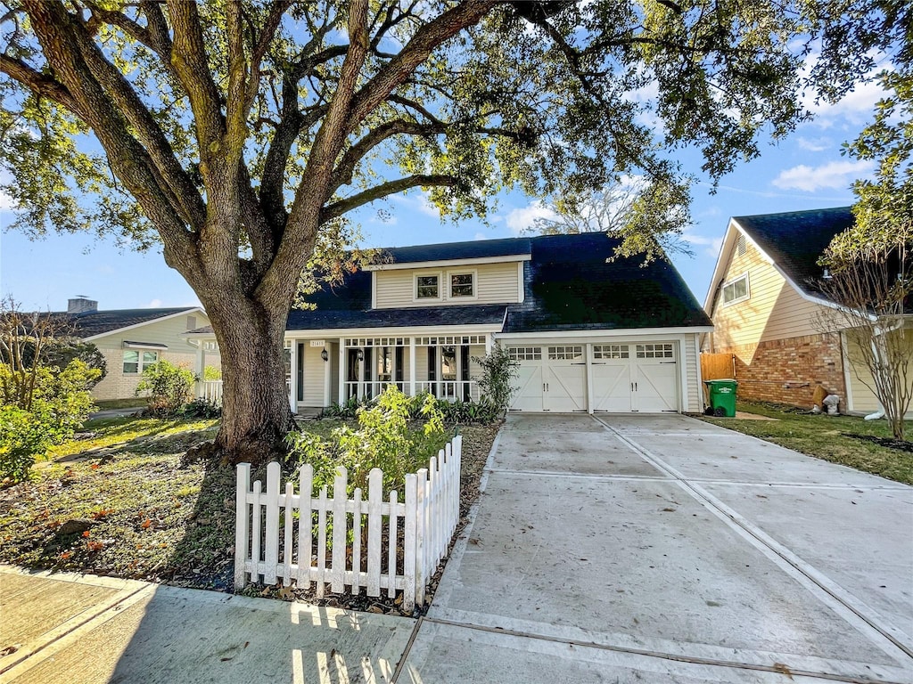 front of property featuring a garage and a porch