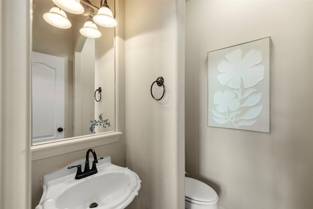 bathroom featuring sink and toilet