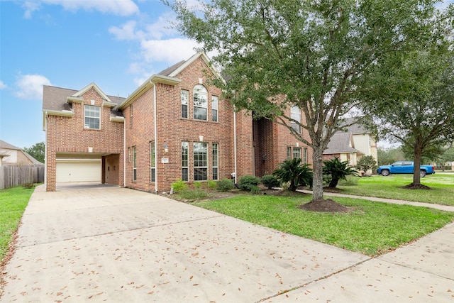 view of property featuring a garage and a front yard