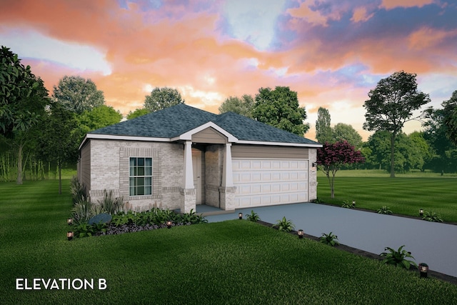 view of front of home with a garage and a lawn