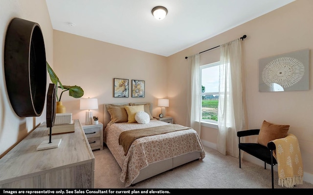 bedroom with light colored carpet