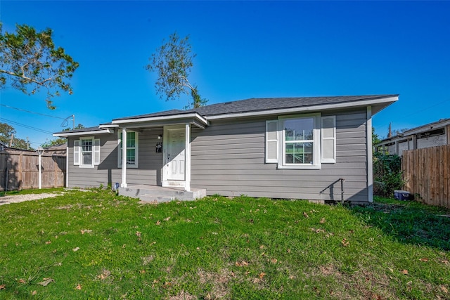 view of front of home with a front yard