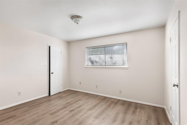 unfurnished bedroom featuring light wood-type flooring