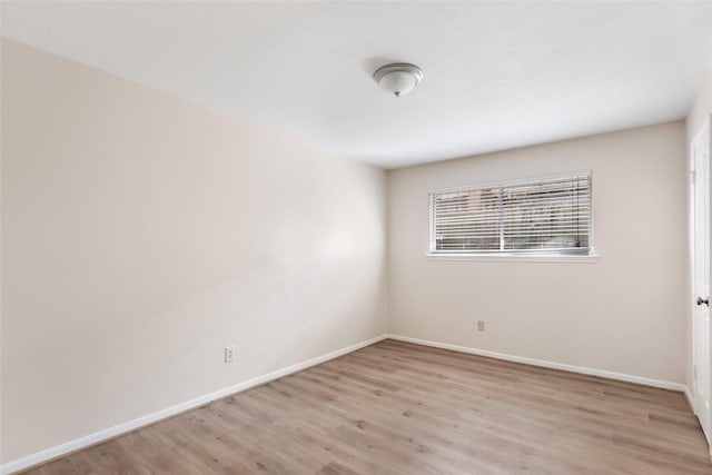 spare room with light hardwood / wood-style floors