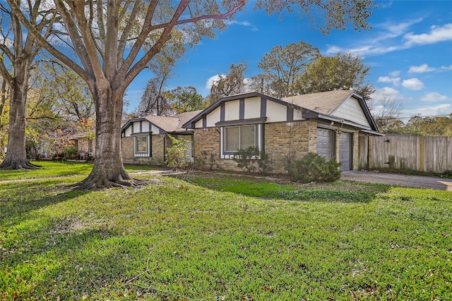 view of front of home featuring a garage and a front yard