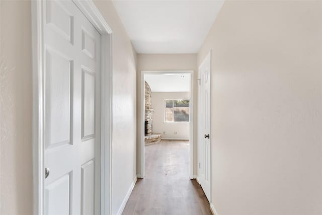 corridor featuring light wood-type flooring