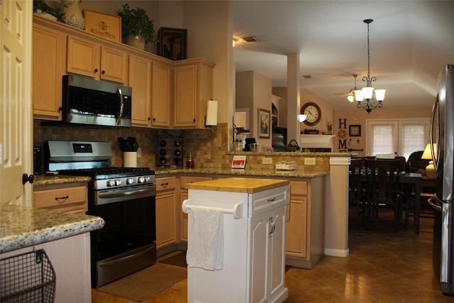 kitchen featuring wooden counters, appliances with stainless steel finishes, a center island, tasteful backsplash, and decorative light fixtures