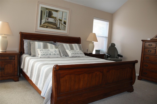 carpeted bedroom featuring vaulted ceiling