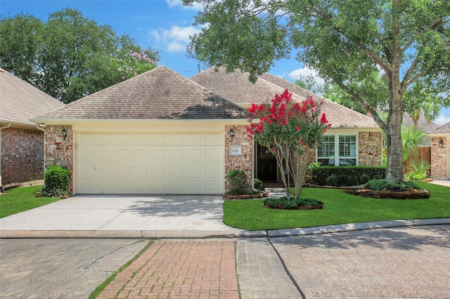 3011 Candle Bend Dr, Spring, TX 77388 - view of front of house with driveway, an attached garage, a front lawn, and a shingled roof