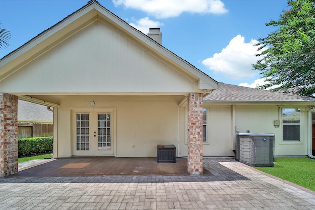 3011 Candle Bend Dr, Spring, TX 77388 - back of property with a patio, french doors, a chimney, and a shingled roof