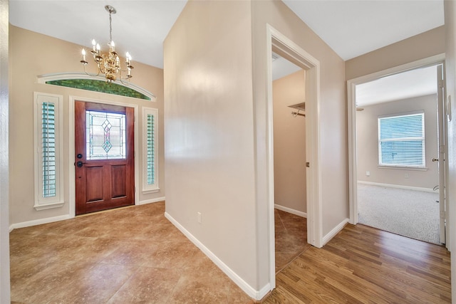3011 Candle Bend Dr, Spring, TX 77388 - foyer with a chandelier and light wood-type flooring