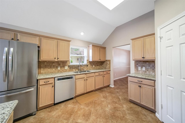 3011 Candle Bend Dr, Spring, TX 77388 - kitchen with stainless steel appliances, lofted ceiling, light brown cabinets, and tasteful backsplash