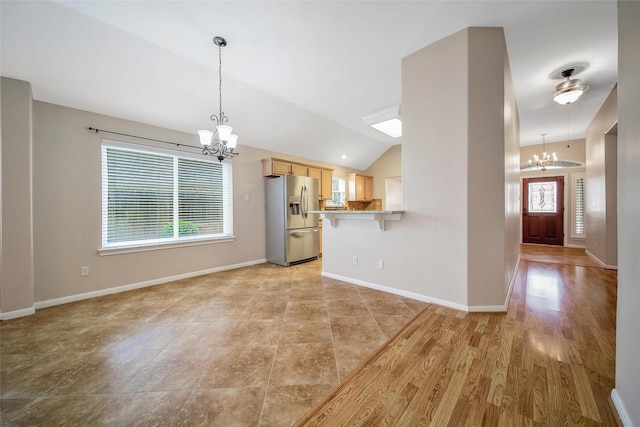 3011 Candle Bend Dr, Spring, TX 77388 - unfurnished living room featuring a chandelier, plenty of natural light, and vaulted ceiling