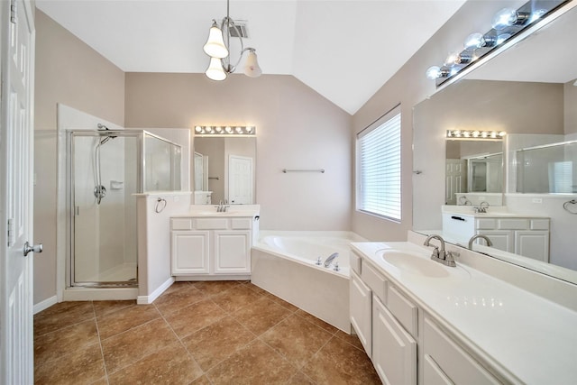 3011 Candle Bend Dr, Spring, TX 77388 - bathroom featuring a shower stall, lofted ceiling, a garden tub, two vanities, and tile patterned floors