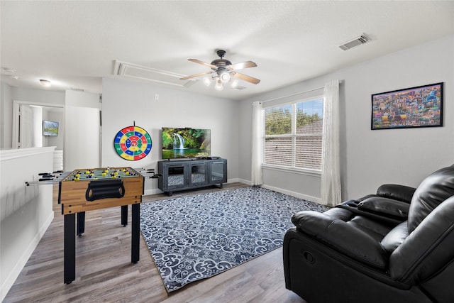 recreation room featuring hardwood / wood-style flooring and ceiling fan