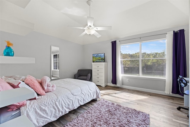 bedroom with lofted ceiling, ceiling fan, and light hardwood / wood-style flooring