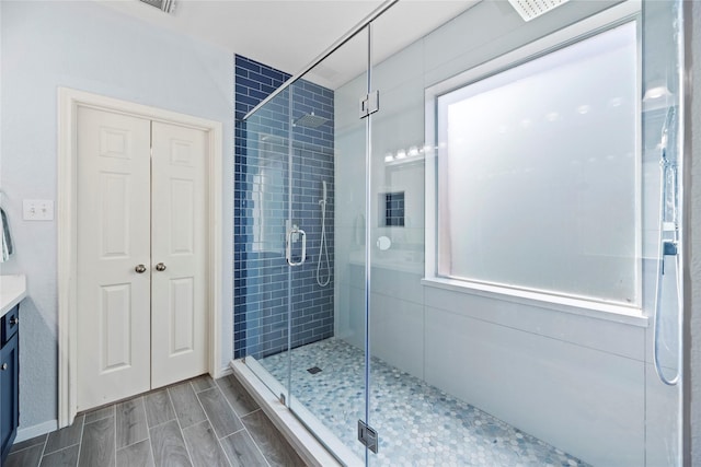 bathroom with vanity and walk in shower