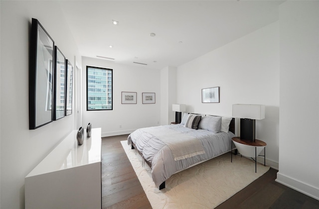 bedroom featuring dark wood-type flooring