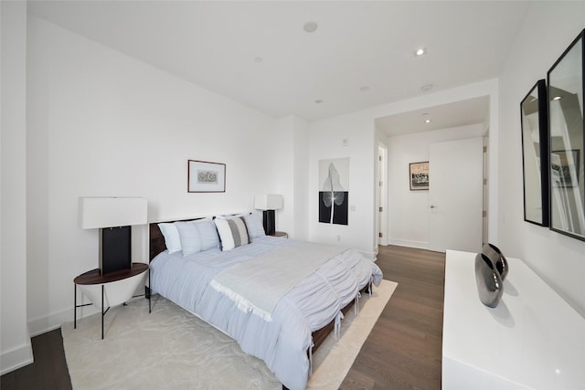 bedroom with hardwood / wood-style flooring