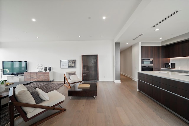 living room with light hardwood / wood-style floors